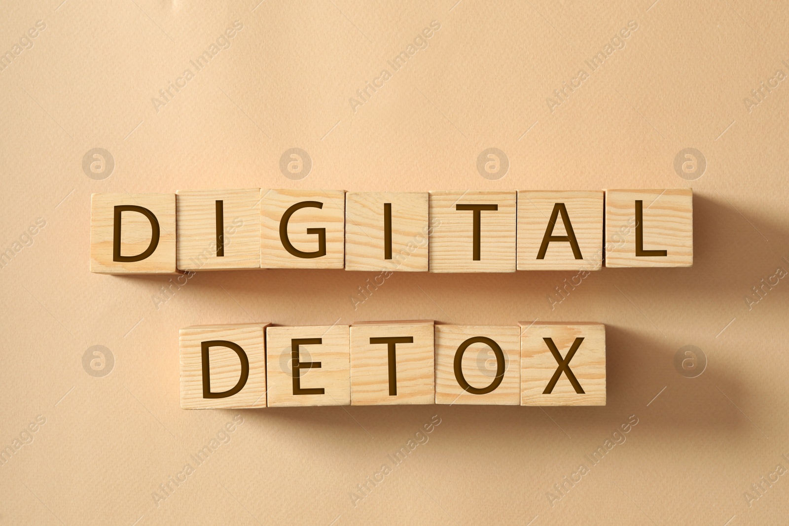 Wooden cubes with words DIGITAL DETOX on beige background, flat lay Photo of Wooden cubes with words DIGITAL DETOX on beige background, flat lay