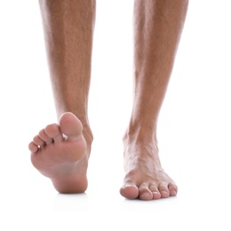 Man standing on white background, closeup of feet Photo of Man standing on white background, closeup of feet