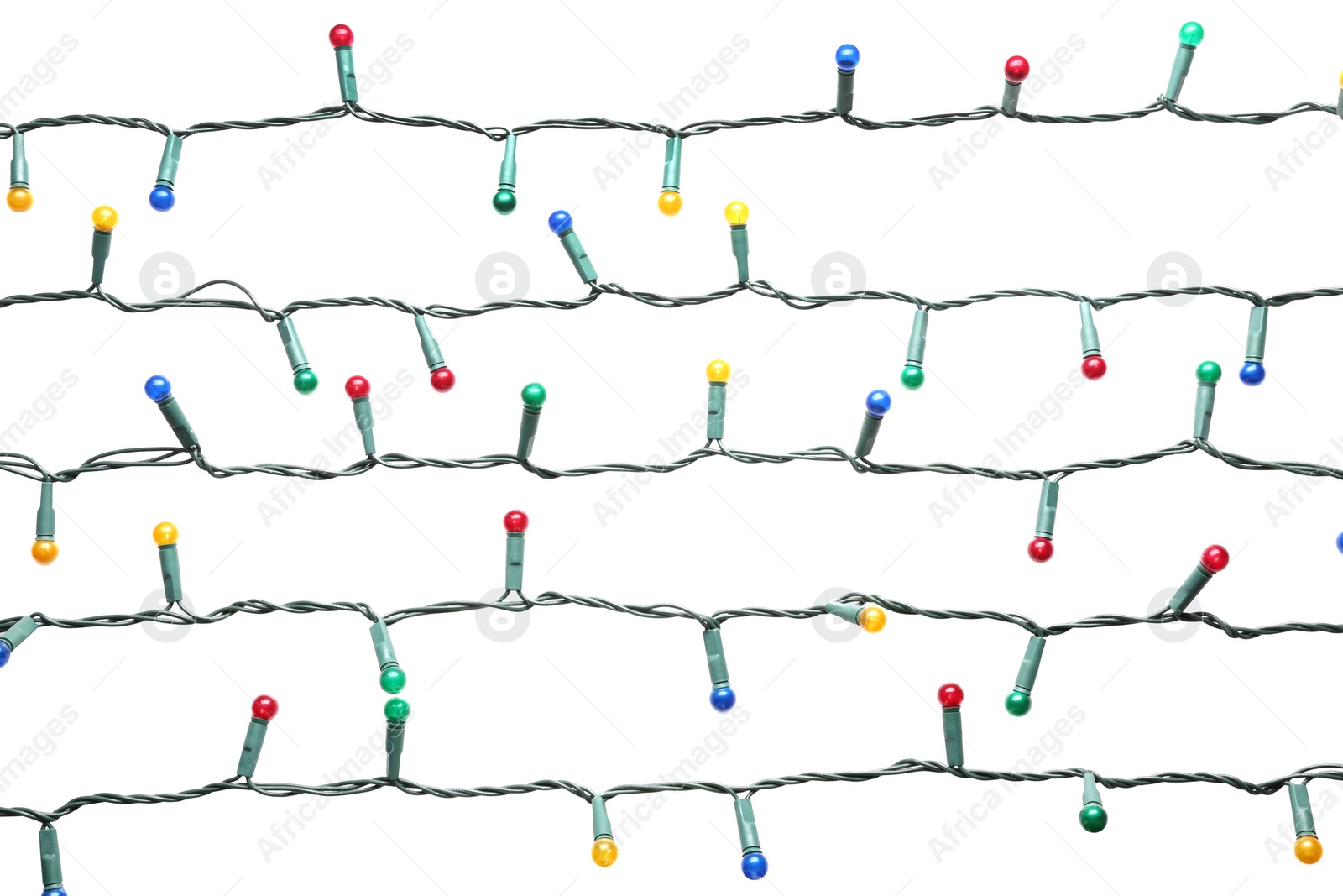 Christmas lights on white background. Festive decoration Photo of Christmas lights on white background. Festive decoration