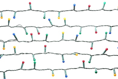 Christmas lights on white background. Festive decoration Photo of Christmas lights on white background. Festive decoration