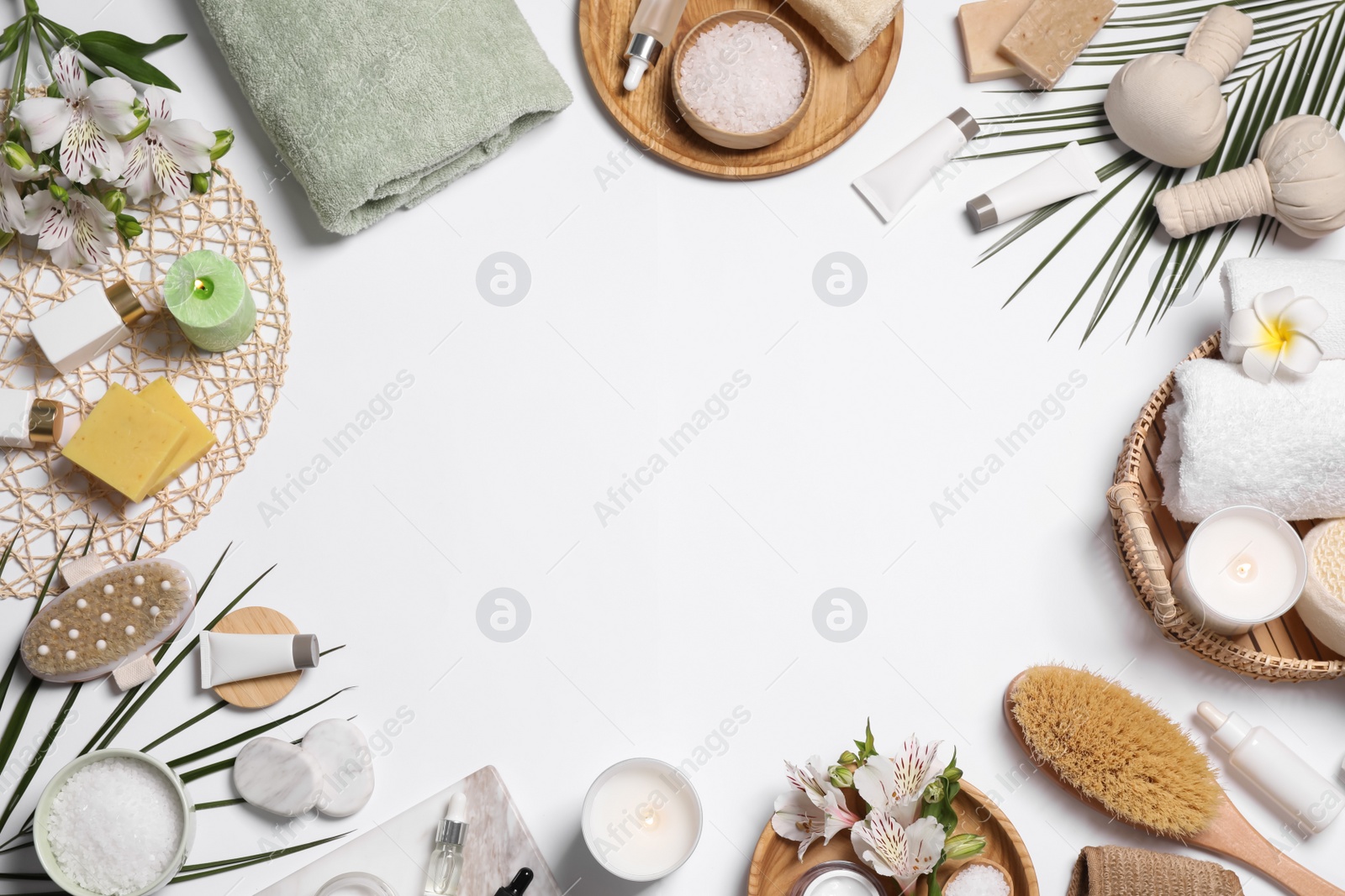 Frame of spa essentials on white background, flat lay. Space for text Photo of Frame of spa essentials on white background, flat lay. Space for text