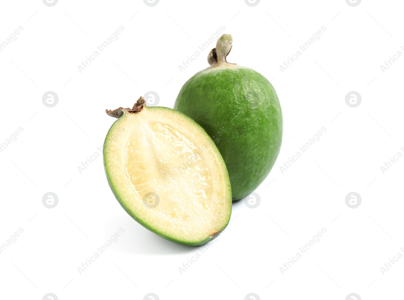 Cut and whole feijoas on white background Photo of Cut and whole feijoas on white background