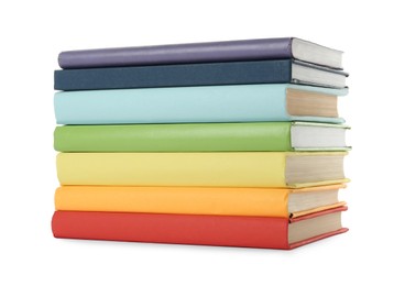 Many colorful hardcover books on white background Photo of Many colorful hardcover books on white background