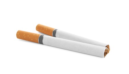 Cigarettes with orange filters isolated on white Photo of Cigarettes with orange filters isolated on white
