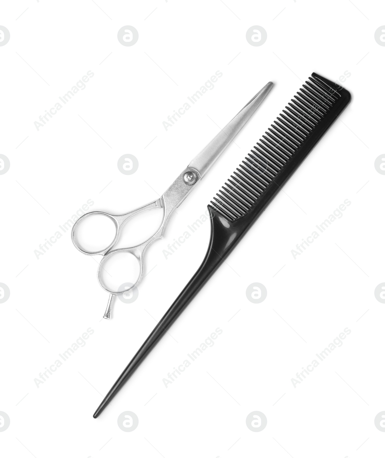 Professional hairdresser scissors and black comb isolated on white, top view. Haircut tools Photo of Professional hairdresser scissors and black comb isolated on white, top view. Haircut tools