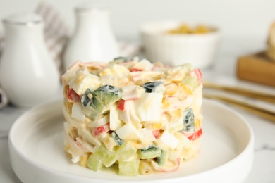 Delicious salad with fresh crab sticks on plate, closeup Photo of Delicious salad with fresh crab sticks on plate, closeup