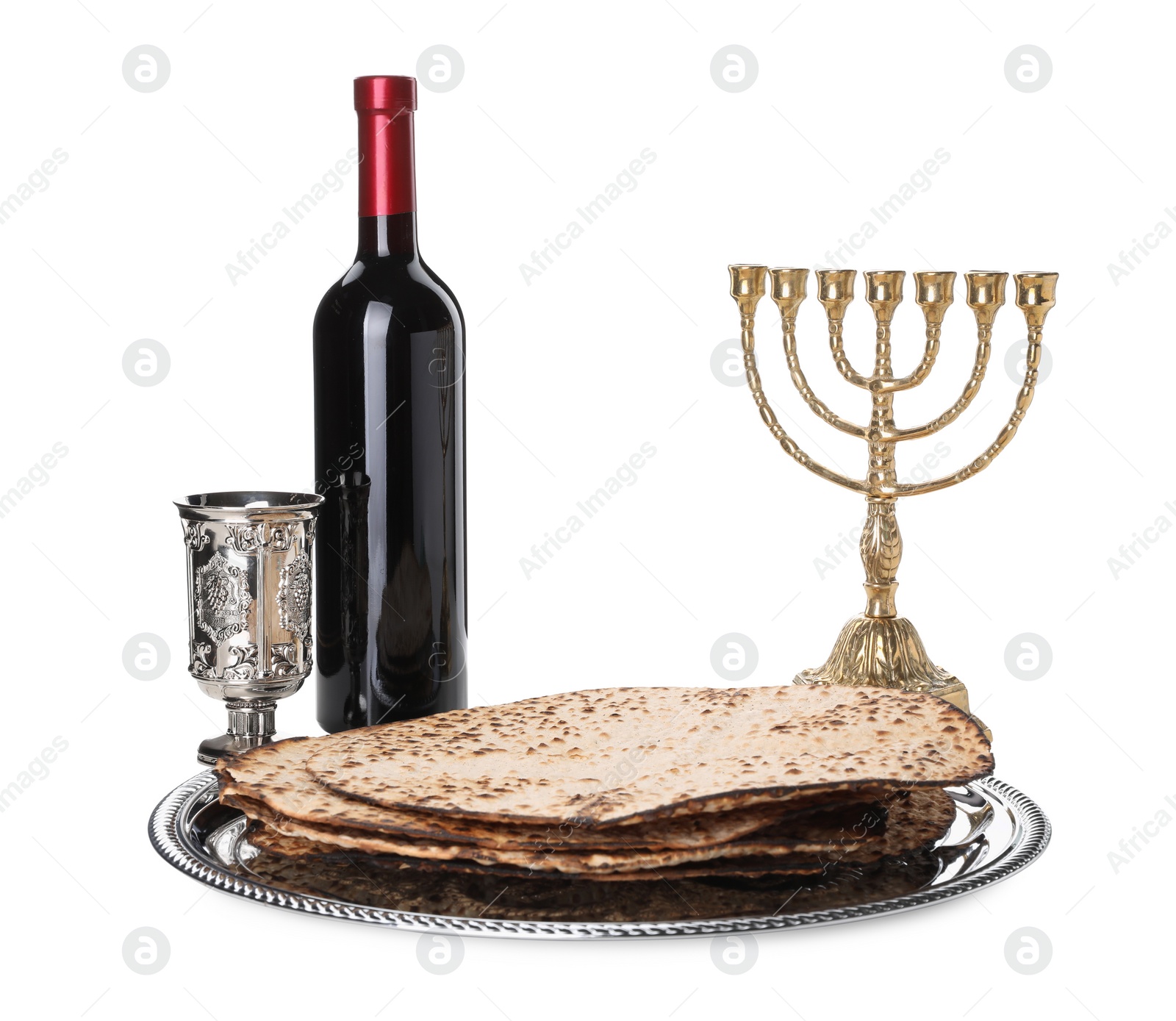 Tasty matzos, wine and menorah on white background. Passover (Pesach) celebration Photo of Tasty matzos, wine and menorah on white background. Passover (Pesach) celebration