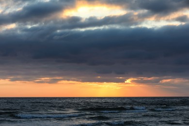 Picturesque view of beautiful sky with clouds over sea at sunset Photo of Picturesque view of beautiful sky with clouds over sea at sunset