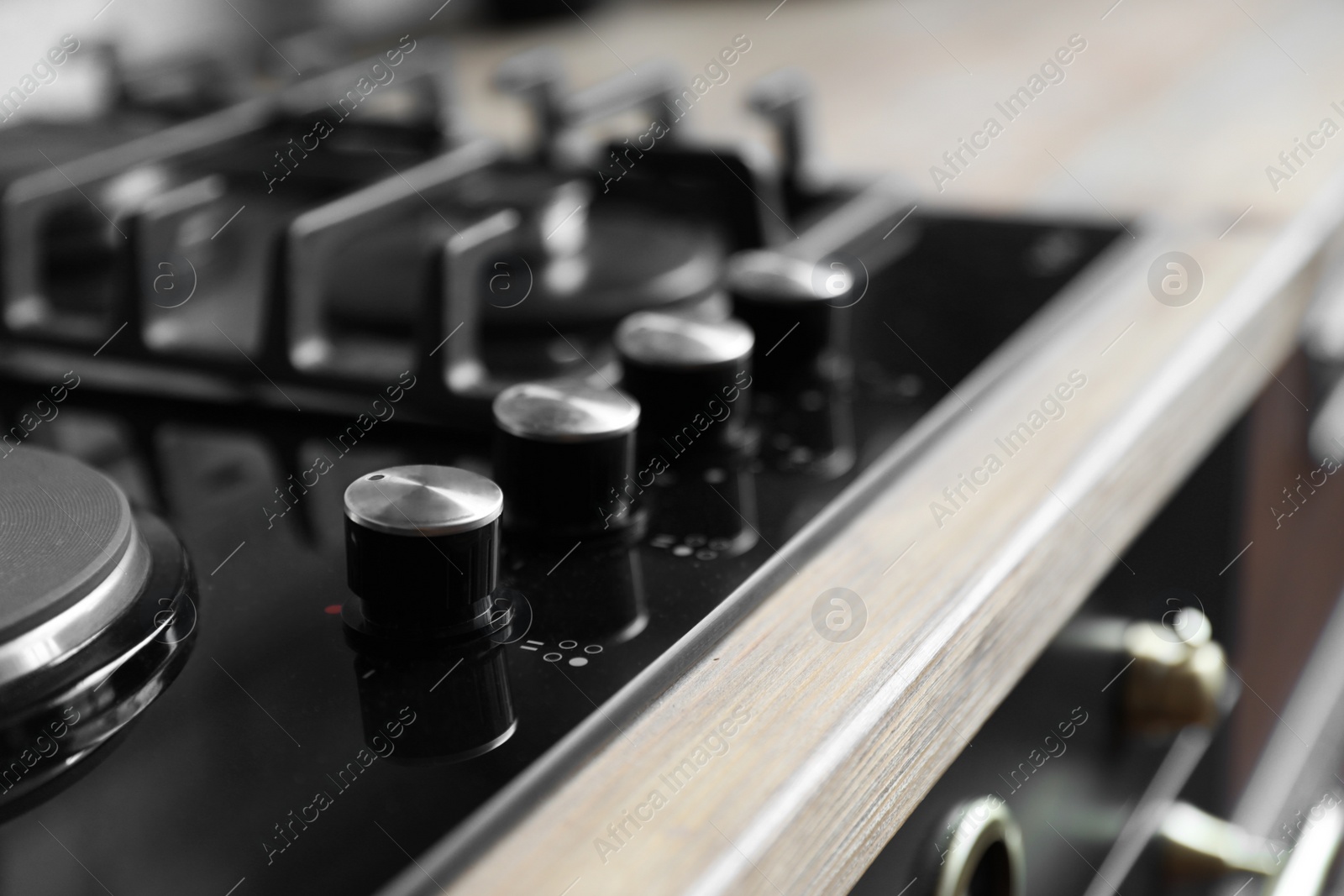 Photo of New modern stove, closeup view. Kitchen appliance