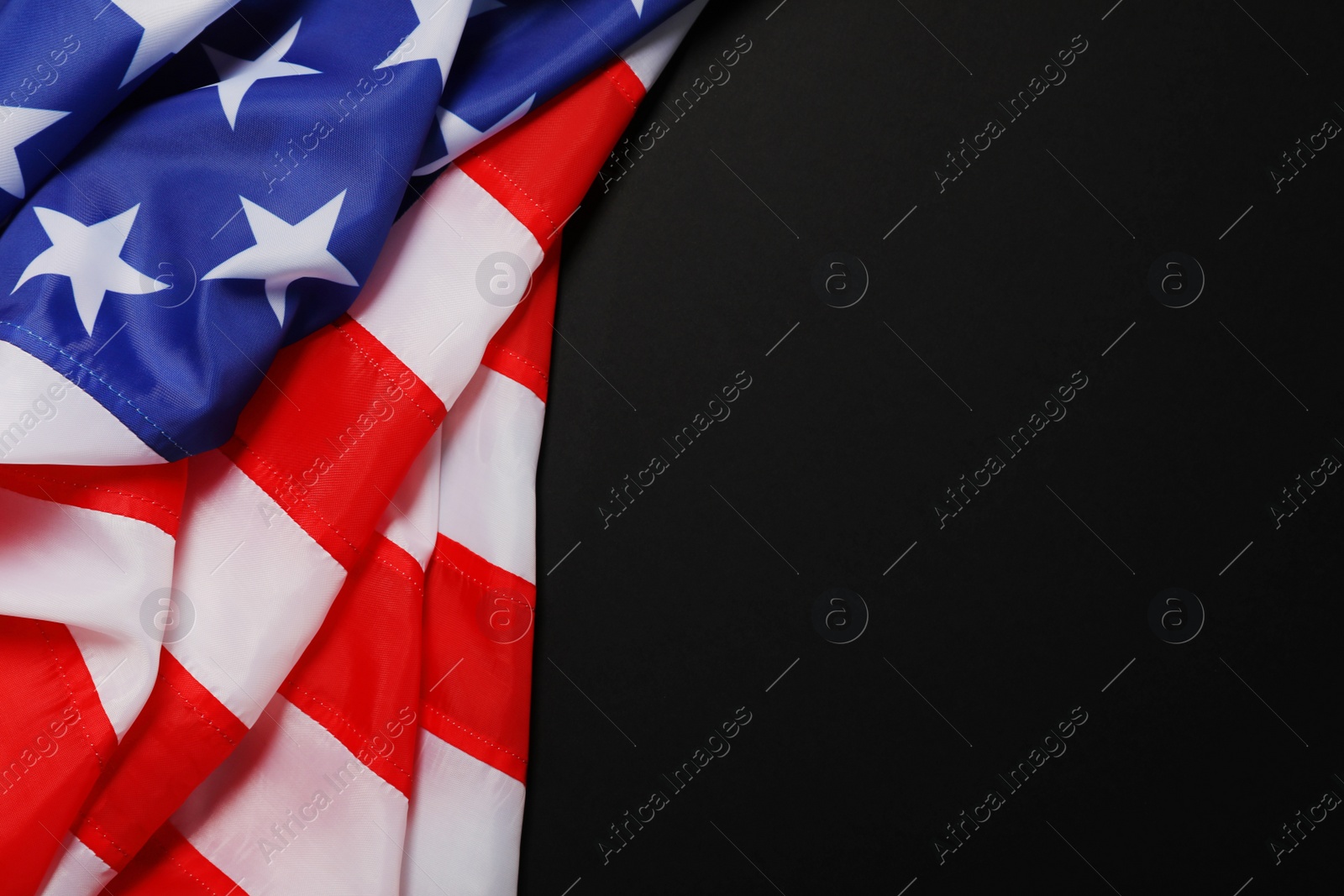 American flag on black background, top view with space for text Photo of American flag on black background, top view with space for text