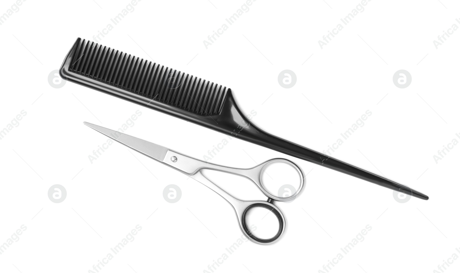 New scissors and comb on white background, top view. Professional tool for haircut Photo of New scissors and comb on white background, top view. Professional tool for haircut