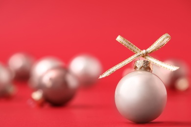 Beautiful Christmas balls on red background. Space for text Photo of Beautiful Christmas balls on red background. Space for text