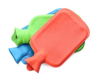Rubber hot water bottles isolated on white, top view Photo of Rubber hot water bottles isolated on white, top view