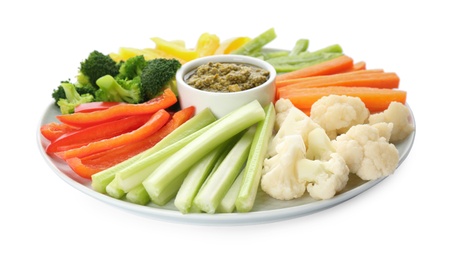 Plate with celery sticks, other vegetables and dip sauce isolated on white Photo of Plate with celery sticks, other vegetables and dip sauce isolated on white