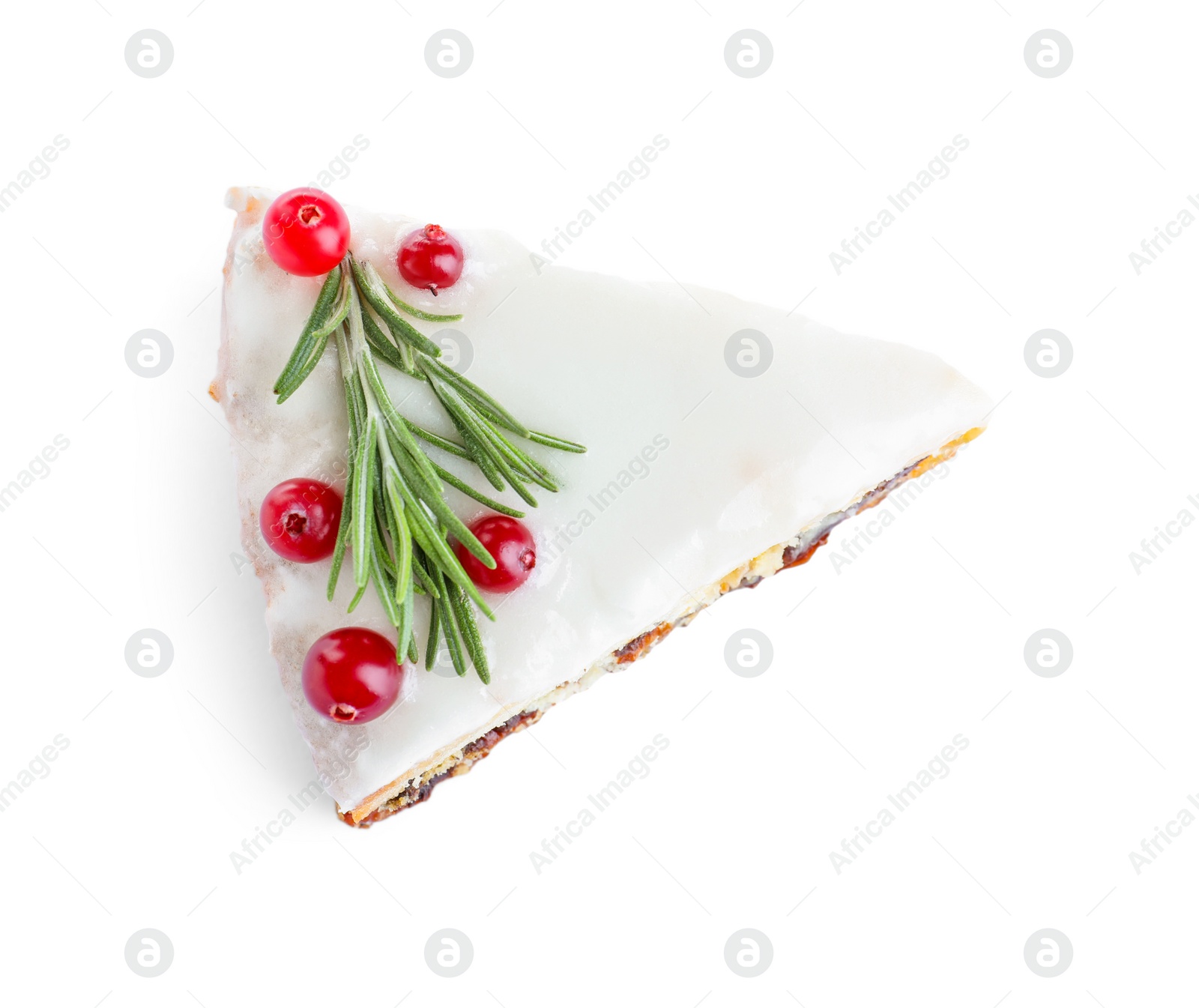 Slice of traditional Christmas cake decorated with rosemary and cranberries isolated on white, top view Photo of Slice of traditional Christmas cake decorated with rosemary and cranberries isolated on white, top view
