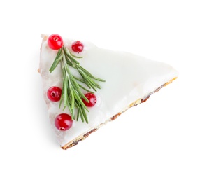 Slice of traditional Christmas cake decorated with rosemary and cranberries isolated on white, top view Photo of Slice of traditional Christmas cake decorated with rosemary and cranberries isolated on white, top view