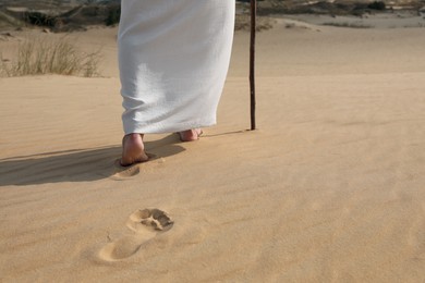 Jesus Christ walking in desert, closeup view Photo of Jesus Christ walking in desert, closeup view