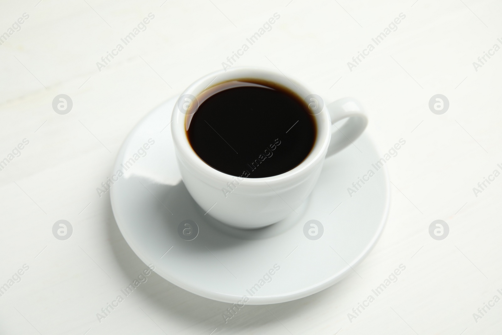 Cup of hot aromatic espresso on white background Photo of Cup of hot aromatic espresso on white background