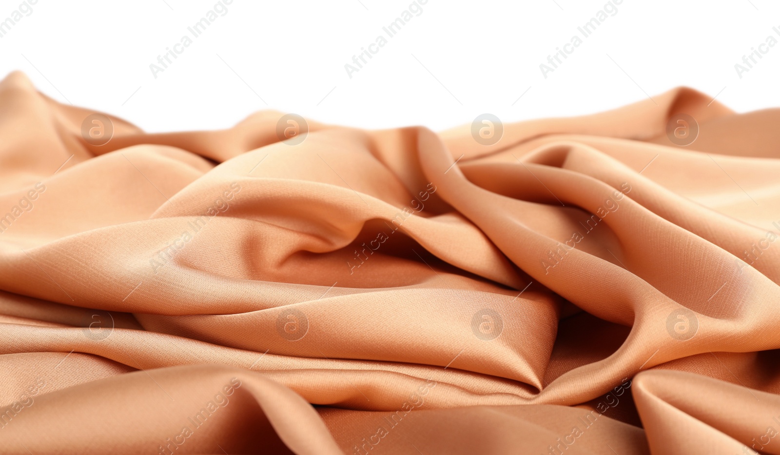 Photo of Beautiful delicate peach silk on white background