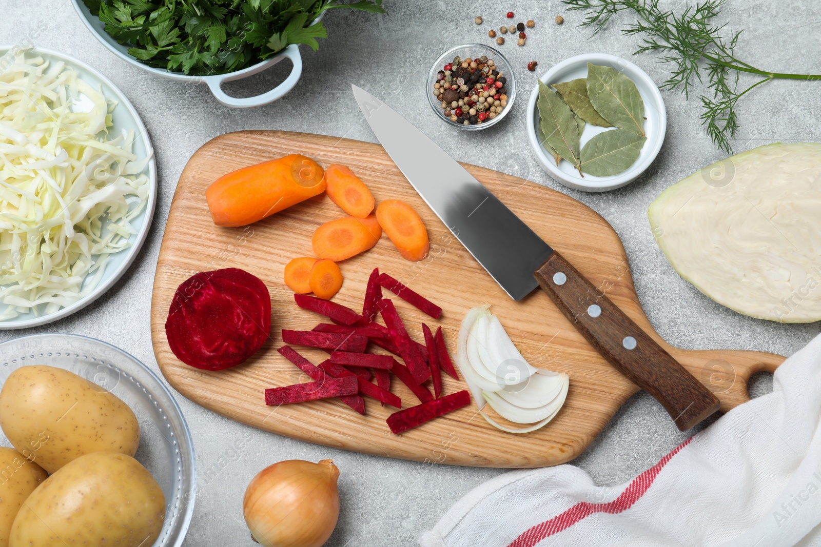 Fresh ingredients for borscht on light grey table, flat lay Photo of Fresh ingredients for borscht on light grey table, flat lay