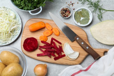 Fresh ingredients for borscht on light grey table, flat lay Photo of Fresh ingredients for borscht on light grey table, flat lay