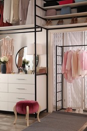 Modern wardrobe room interior with stylish furniture Photo of Modern wardrobe room interior with stylish furniture