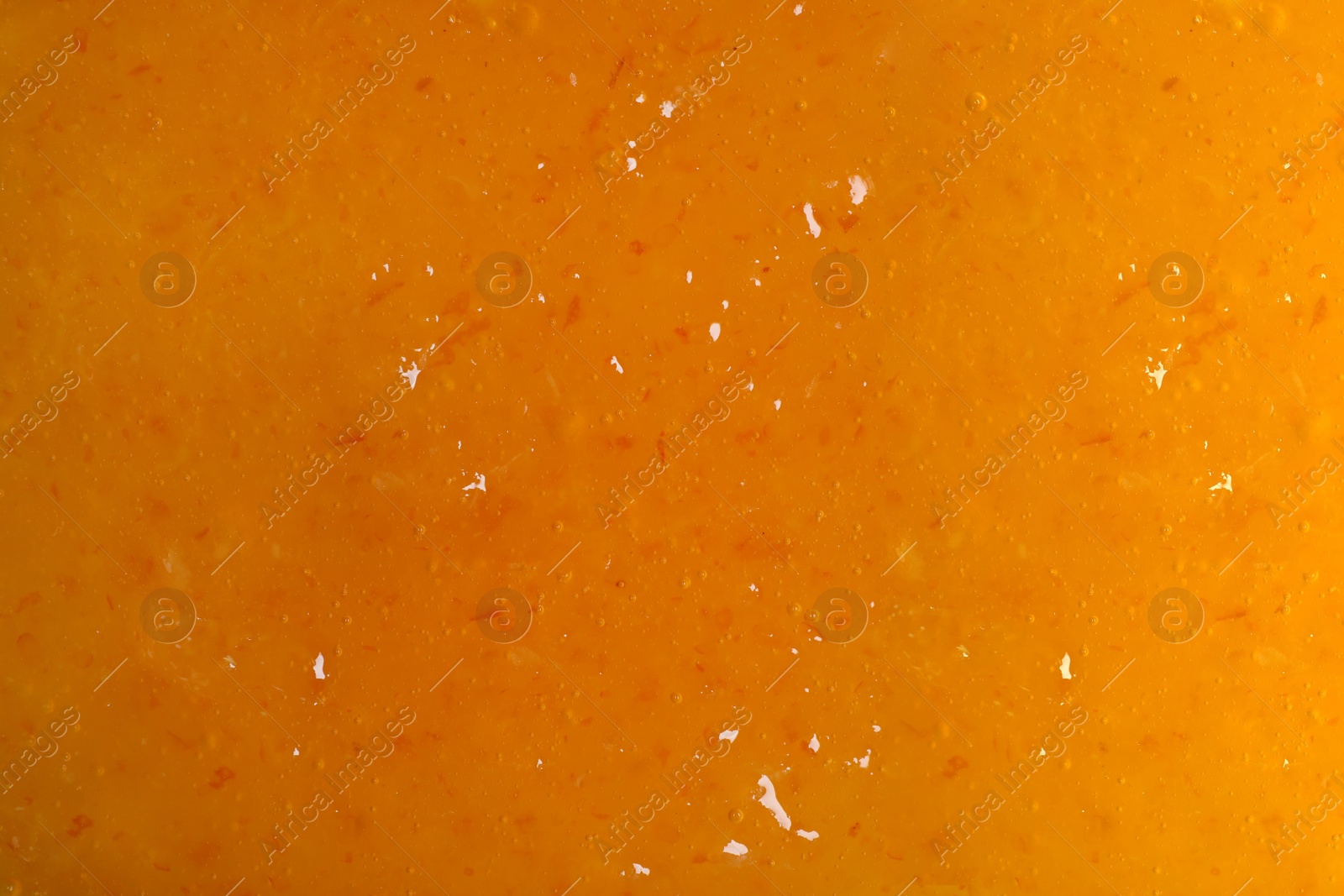 Sweet apricot jam as background, closeup view Image of Sweet apricot jam as background, closeup view