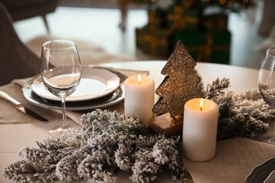 Elegant table setting with Christmas decor indoors Photo of Elegant table setting with Christmas decor indoors