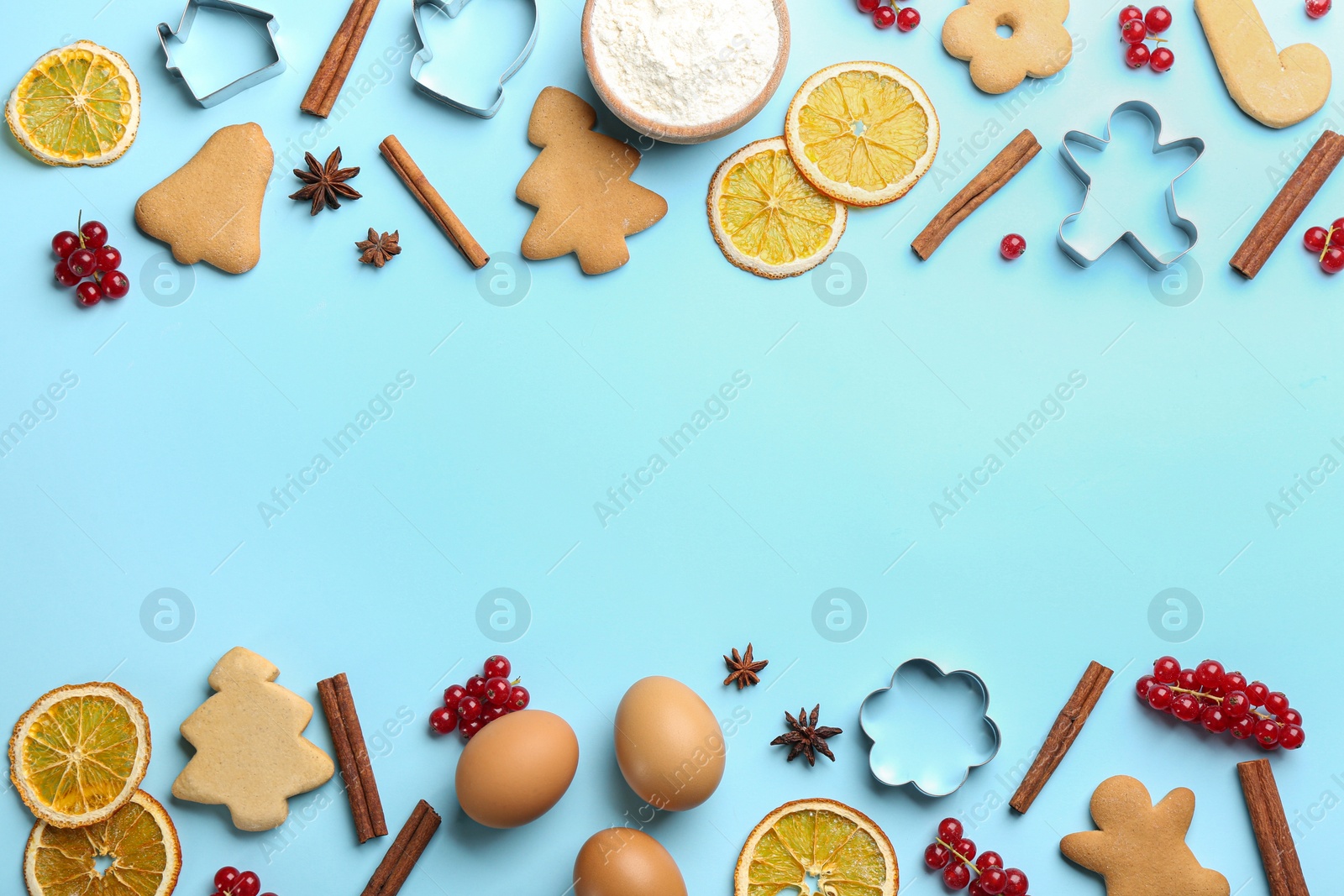 Frame of Christmas cookies and flour on light blue background, flat lay. Space for text Photo of Frame of Christmas cookies and flour on light blue background, flat lay. Space for text