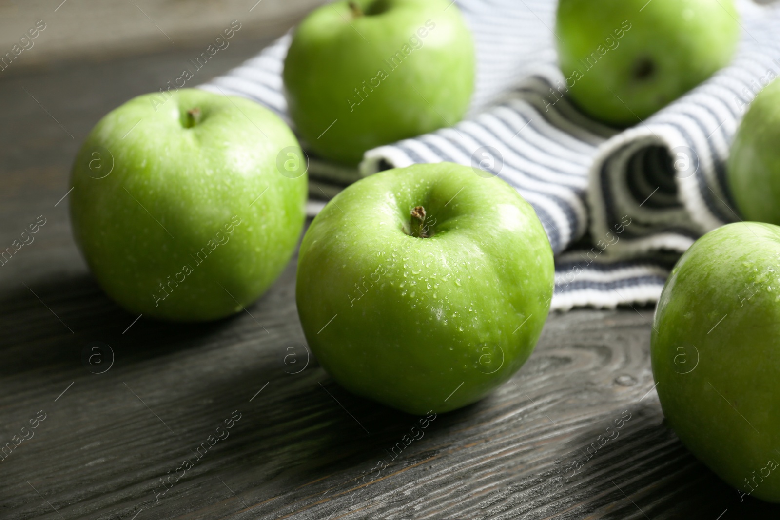 Fresh green apples on wooden table Photo of Fresh green apples on wooden table