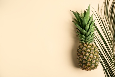 Fresh ripe juicy pineapple on beige background, top view. Space for text Photo of Fresh ripe juicy pineapple on beige background, top view. Space for text