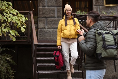 Couple with travel backpacks outdoors. Urban trip Photo of Couple with travel backpacks outdoors. Urban trip
