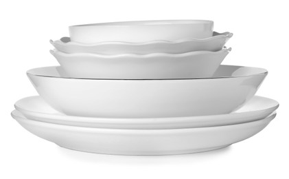 Stack of clean ceramic dishware isolated on white Photo of Stack of clean ceramic dishware isolated on white