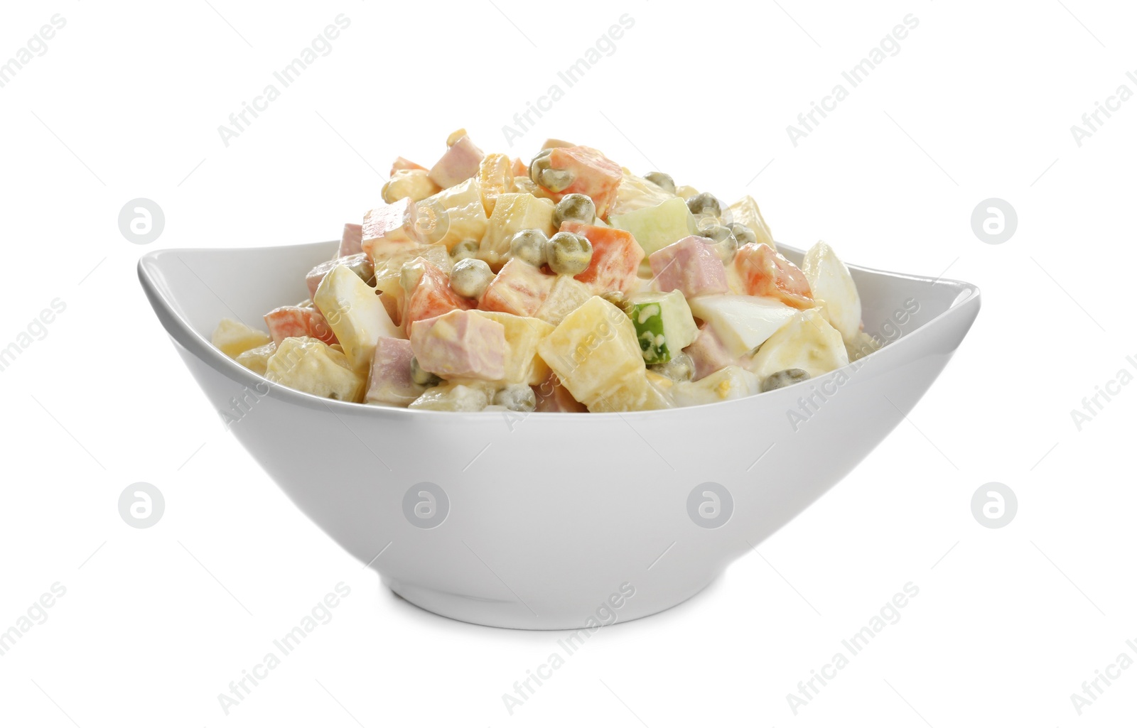 Delicious russian salad Olivier on white background Photo of Delicious russian salad Olivier on white background