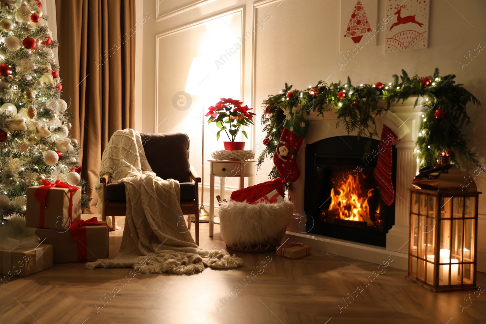 Stylish room interior with fireplace and beautiful Christmas tree Photo of Stylish room interior with fireplace and beautiful Christmas tree