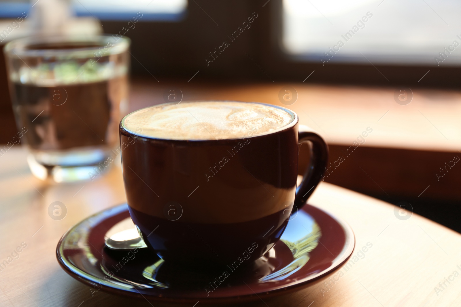 Aromatic coffee on wooden table in cafe, closeup Photo of Aromatic coffee on wooden table in cafe, closeup