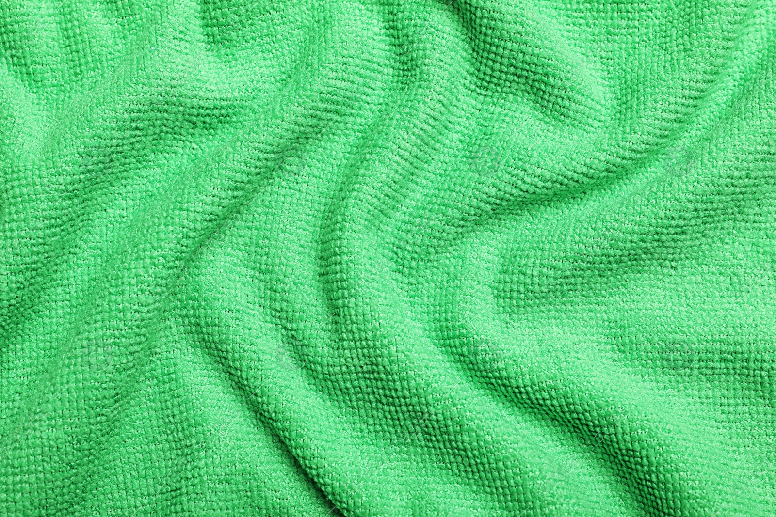 Crumpled light green microfiber cloth as background, closeup Photo of Crumpled light green microfiber cloth as background, closeup