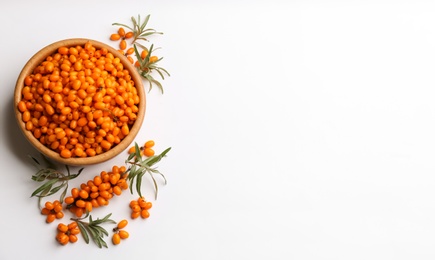 Fresh ripe sea buckthorn on white background, flat lay. Space for text Photo of Fresh ripe sea buckthorn on white background, flat lay. Space for text
