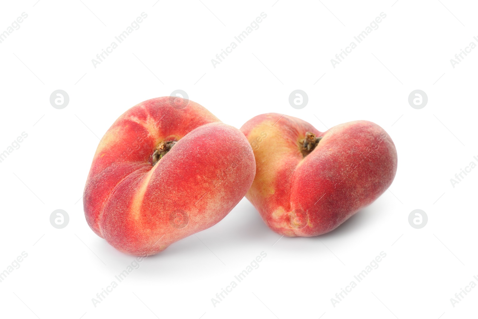 Fresh ripe donut peaches on white background Photo of Fresh ripe donut peaches on white background
