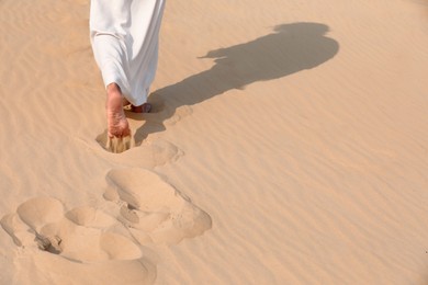 Jesus Christ walking in desert, closeup. Space for text Photo of Jesus Christ walking in desert, closeup. Space for text