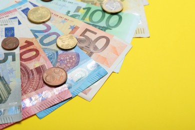 Money on yellow background, closeup. Space for text Image of Money on yellow background, closeup. Space for text