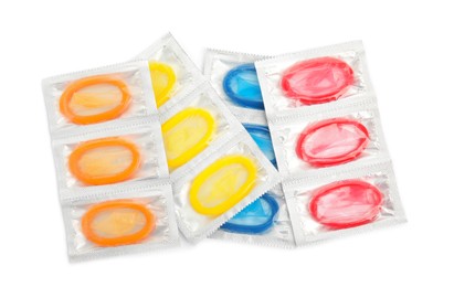 Condom packages on white background, top view. Safe sex Photo of Condom packages on white background, top view. Safe sex
