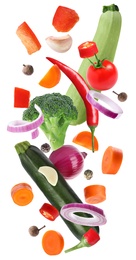 Set of different fresh vegetables and spices falling on white background Image of Set of different fresh vegetables and spices falling on white background