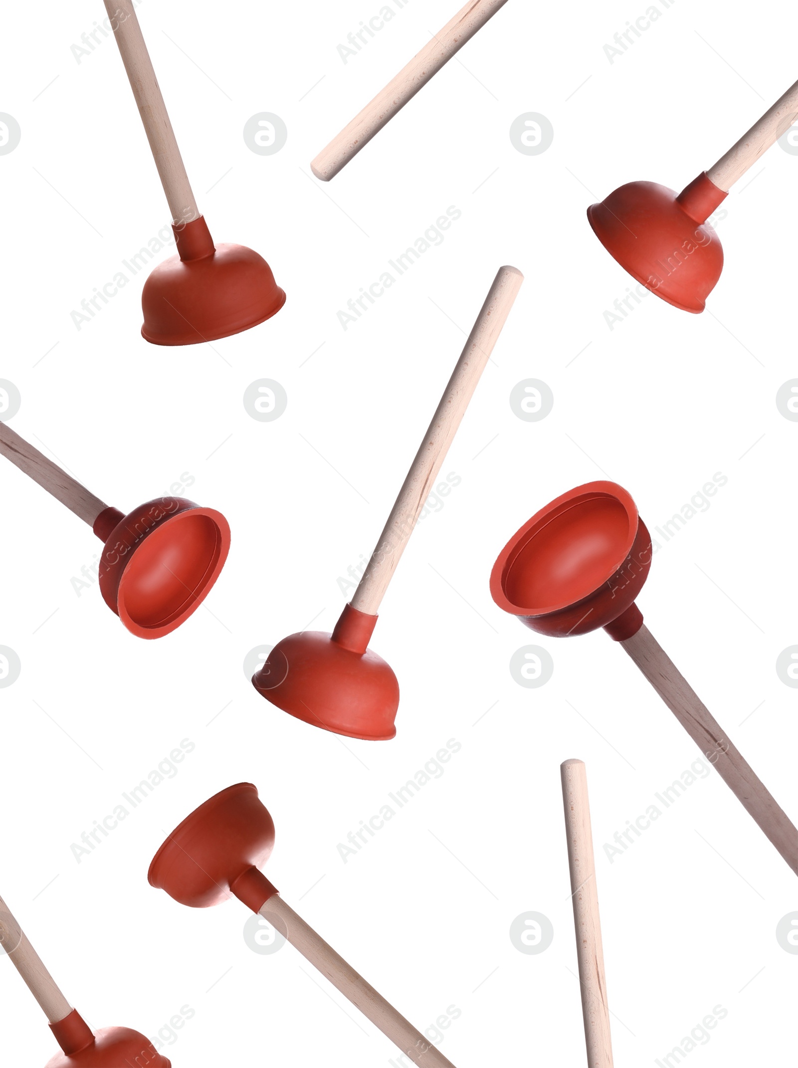 Plungers with wooden handles falling on white background Image of Plungers with wooden handles falling on white background