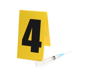 Syringe and crime scene marker with number four isolated on white Photo of Syringe and crime scene marker with number four isolated on white