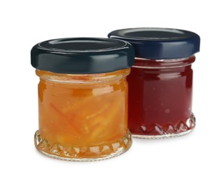 Jars with different jams on white background Photo of Jars with different jams on white background
