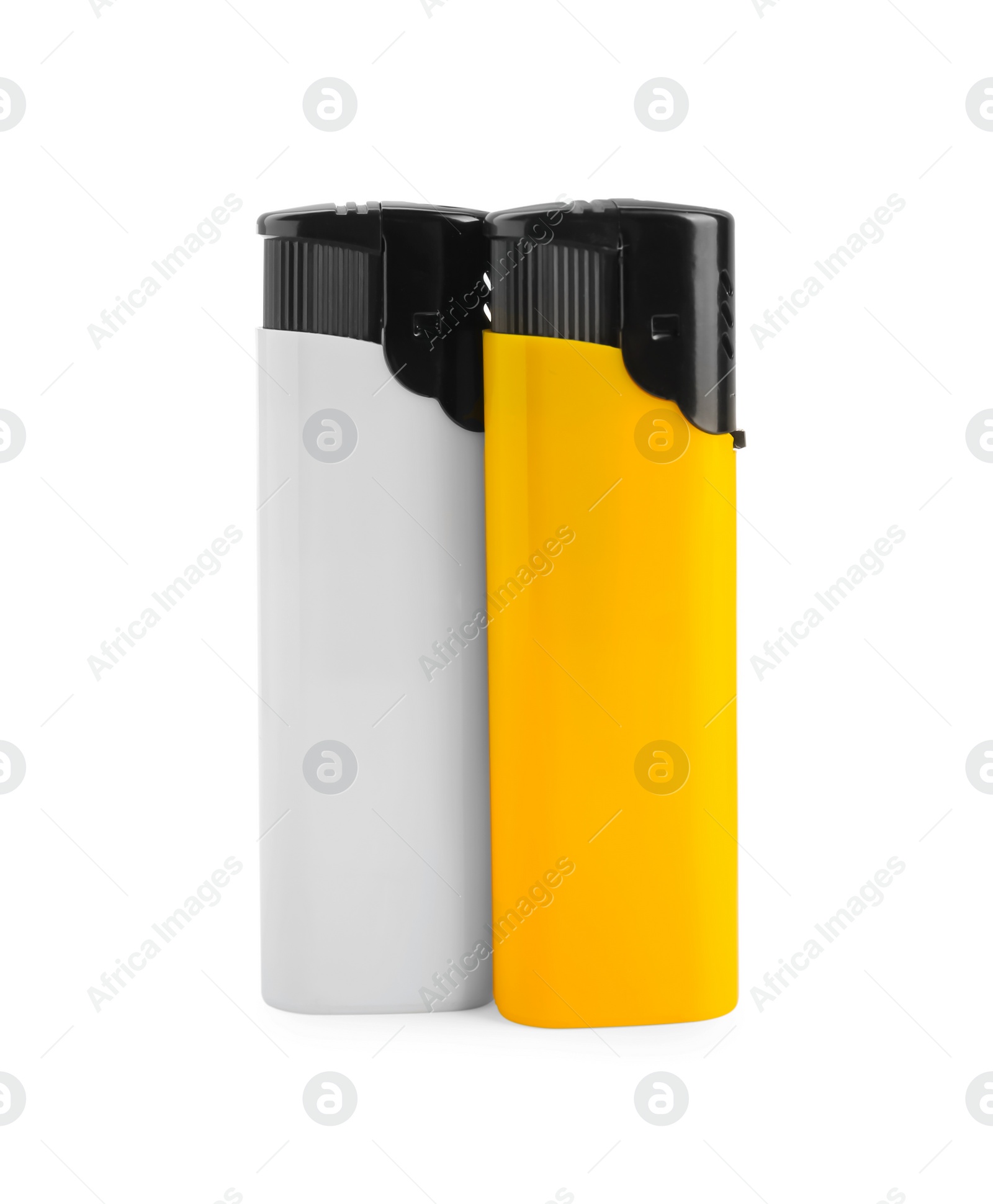 Stylish small pocket lighters on white background Photo of Stylish small pocket lighters on white background