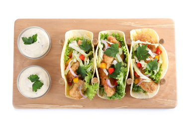 Yummy fish tacos with sauce isolated on white, top view Photo of Yummy fish tacos with sauce isolated on white, top view