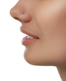 Young woman with nose piercing on white background, closeup Photo of Young woman with nose piercing on white background, closeup