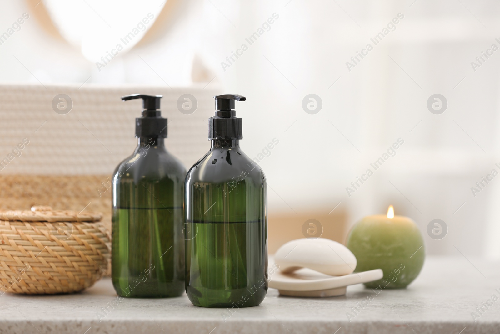 Green soap dispensers on white countertop in bathroom. Space for text Photo of Green soap dispensers on white countertop in bathroom. Space for text